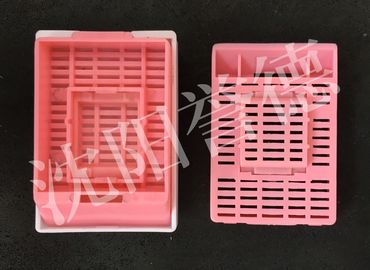 China Mid Size Tissue Embedding Cassette Pink Color Round Hole Layout Without Lid supplier